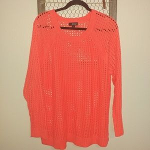 Neon orange long sleeve sweater.